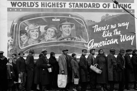 Margaret Bourke-White, African American flood victims lined up to get food and clothing from a Red Cross relief station