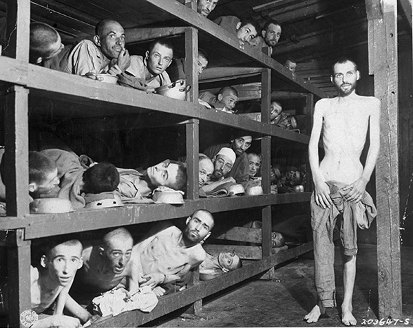 Margaret Bourke-White, Half-starved slave laborers lying in wooden bunks incl. future Nazi-hunter Elie Wiesel