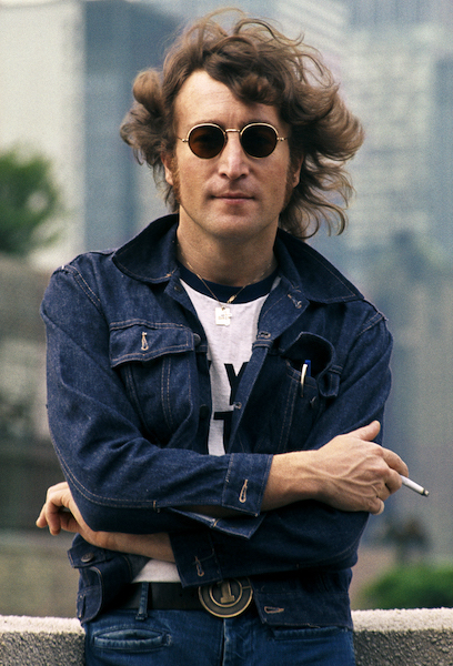 John Lennon on rooftop wearing a denim jacket in NYC. August 29, 1974 © Bob Gruen